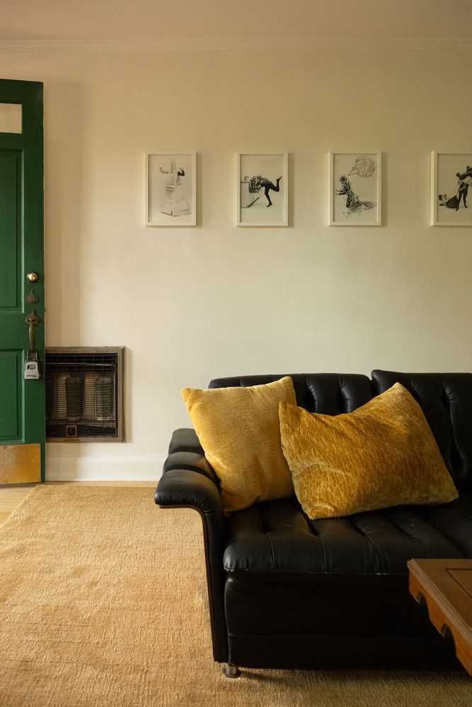 Mid-Century Modern Black Leather Tufted Sofa