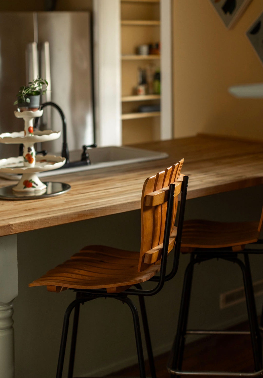 Four Mid-Century Slatted Iron Swivel Stools